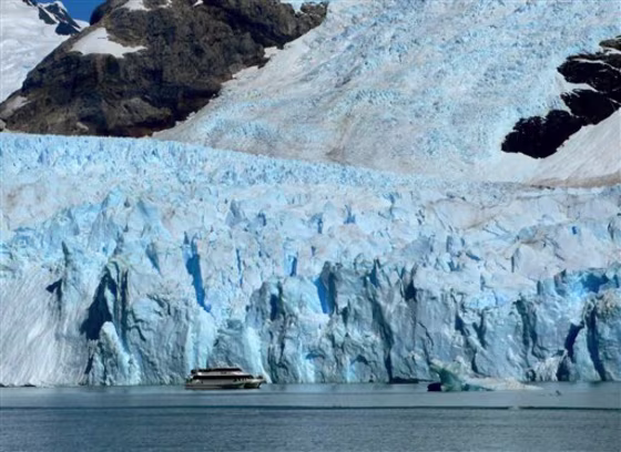 A tour boat passes near the mouth of Spegazzini Glacier on Feb. 23 in Los Glaciares National Park in Argentina. There are dozens of glaciers in the area fed by the Southern Patagonian Ice Field, which blankets a wide swath of the Andes between Chile and Argentina.